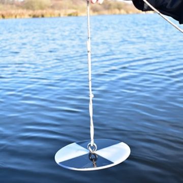 Secchi disk used in water sampling Secchi disk used in water sampling